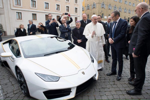 Pope Francis receives a Lamborghini Huracan prior to his Wednesday general audience in Saint Peter's square at the Vatican Saturday. Courtesy of Osservatore Romano via Reuters