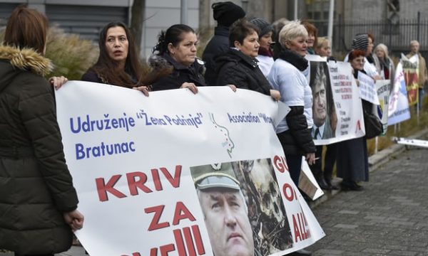 People, including victims, protest in front of the international criminal tribunal for the former Yugoslavia (ICTY) prior to the verdict Photograph: John Thys/AFP/Getty Images
