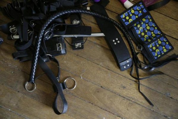 In this April 20, 2017, photo, sex toys are seen on the floor of the home of suspected child webcam cybersex operator, David Timothy Deakin. (AP)