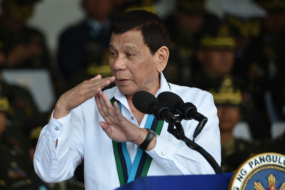 Philippine President Rodrigo Duterte delivers a speech during a ceremony marking the anniversary of the military at Camp Aguinaldo in Quezon City, suburban Manila on Dec. 20, a day after announcing his tax reforms. (Ted Aljibe/AFP)
