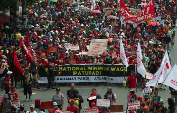 Workers call for an increase in the minimum wage in the country during May Day protest march in Manila. (Photo by Mark Saludes)