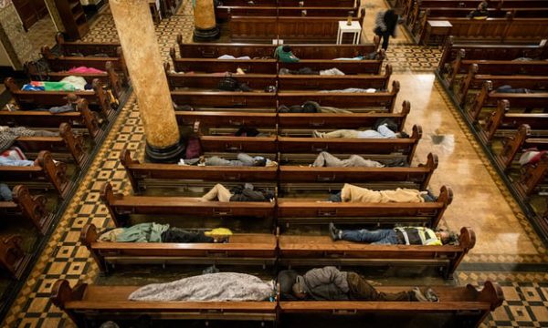 Homeless people sleep in the pews at St Boniface Catholic Church in the San Francisco Tenderloin area, as part of the Gubbio Project. Photograph: David Levene for the Guardian
