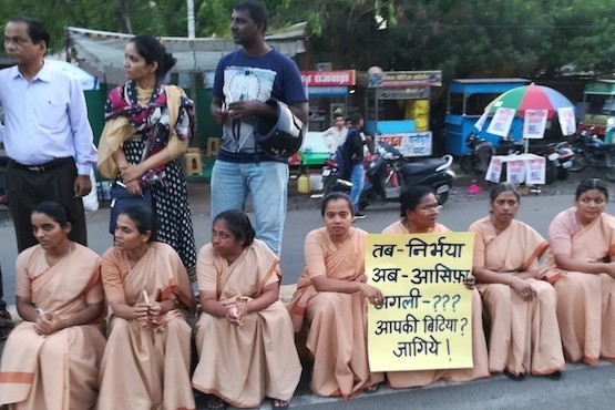 Catholic nuns sit on a roadside in Bhopal after joining a protest march on April 16 against increasing cases of rape of minors. (Photo by Saji Thomas/ucanews.com)